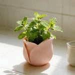 cache pot moderne forme fleur rose clair rose foncé support plante salon table