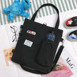 sac main uni jaune blanc vert noir moderne poignées détachables porte clés poche avant