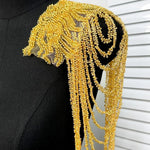 accessoire textile broche franges rouge or noir élégant chic festive decoration