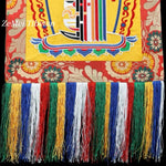 tapisserie décorative tibétaine motifs floraux franges colorées rouge jaune bleu vert blanc