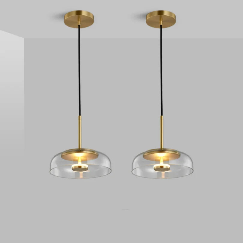 Lampes suspendues modernes transparent doré noir gris abatjour transparent rosace dorée câble suspension LED