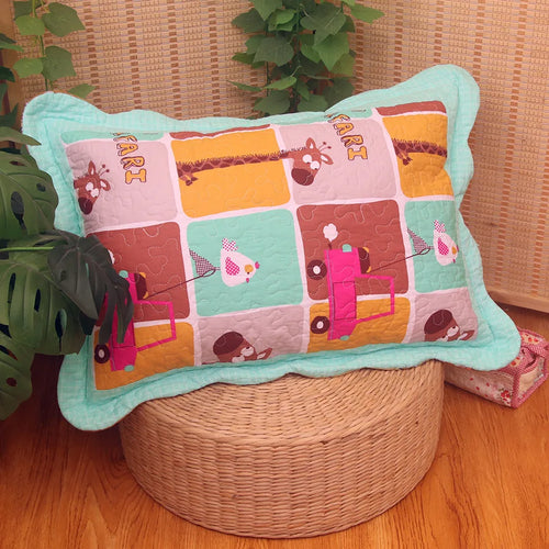 taie d'oreiller enfant coton matelassé motif géométrique bleu orange vert blanc traditionnel