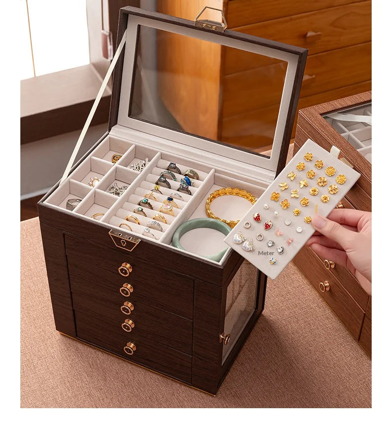 boîte bijoux multi niveaux marron foncé grain bois verre transparent poignées dorées élégante rangement