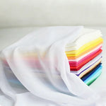 tissu polyester mousseline uni translucide moderne blanc rose bleu violet 150cm cérémonie mariage statuaire