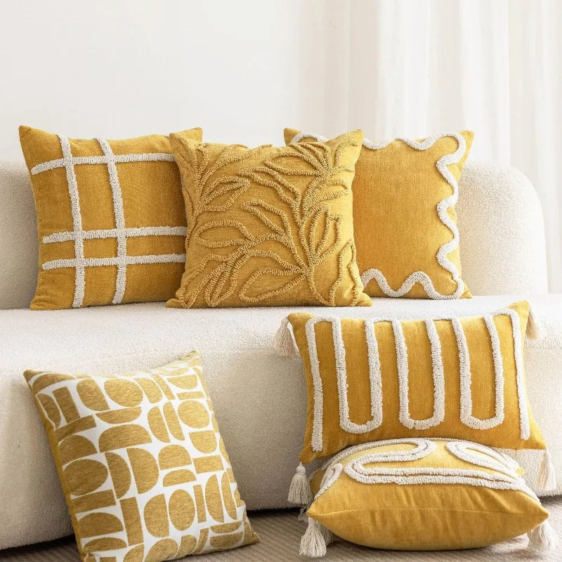 housses coussins géométriques jaunes moderne tissage main pompons adhésifs decoration intérieure bohème tuftées polyestere