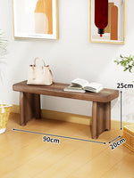 Banc bois marron clair texture naturelle moderne salon tabouret sac main livre ouvert decoration