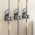 porte balai mural ventouse gris lisse perforations moderne salle bain rangement minimaliste