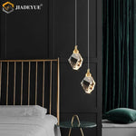 suspension lumineuse moderne transparente facettes géométriques dorées élégante autoinstallation led chambre salon