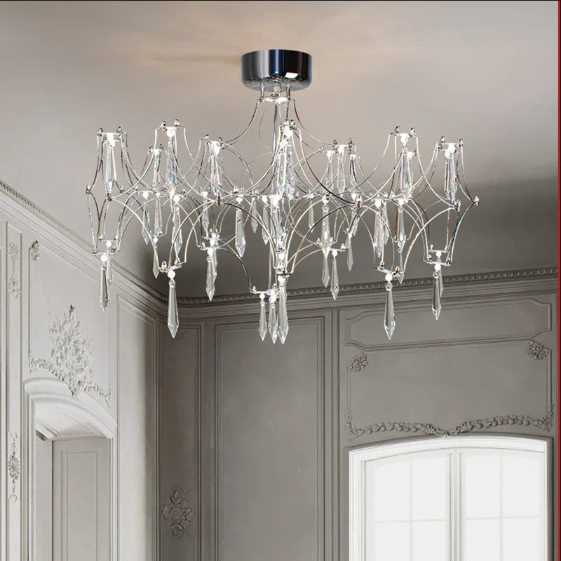 lustre moderne or cristaux transparents branches stylisées salon chambre principale