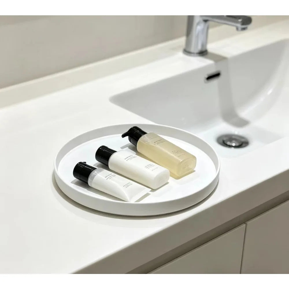 plateau rond blanc surface texturée moderne rangement cosmétiques épices bougies parfumées théière fruits gâteaux