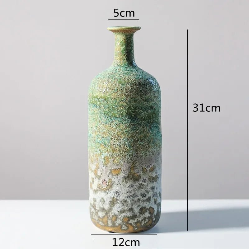 vase céramique rustique vert beige marron texturé variations couleur branches feuilles arrangement floral