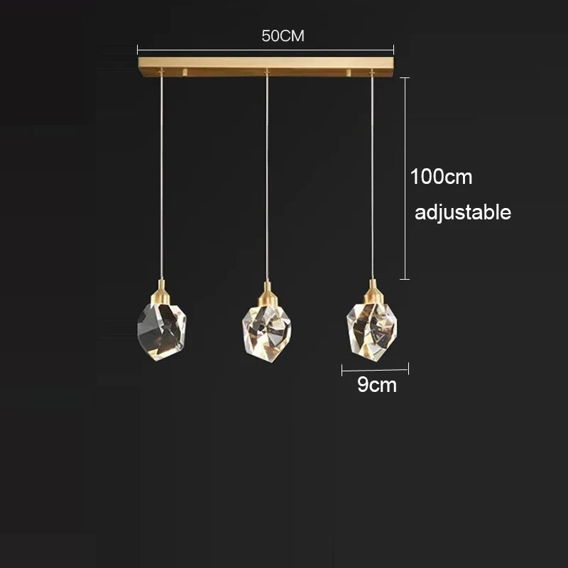 lampe suspendue or transparent cristal facettes géométriques moderne élégante tringles câbles