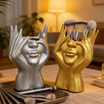support pinceaux maquillage or argent noir visage stylisé moderne sculpturaliaux pinceaux
