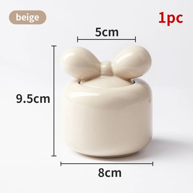Un joli bol décoratif en forme de noeud beige avec dimensions spécifiées.