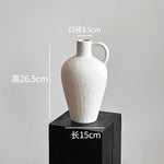 vase poterie moderne gris beige fleur séchée décoration intérieure texture marbrée lisse rustique arrangement
