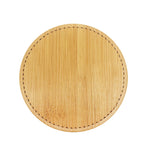 Plateau rond en bois avec motif de points autour des bords.