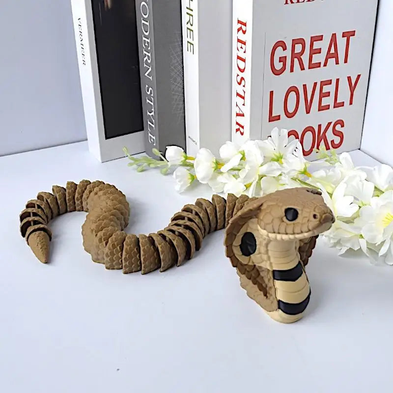 jouet serpent articulé marron noir réelle 33cm décoratif imitations écailles texturées éléments fleurs livres