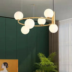 suspension luminaire moderne sphères verre translucides anneau métal doré salon chambre scandinave