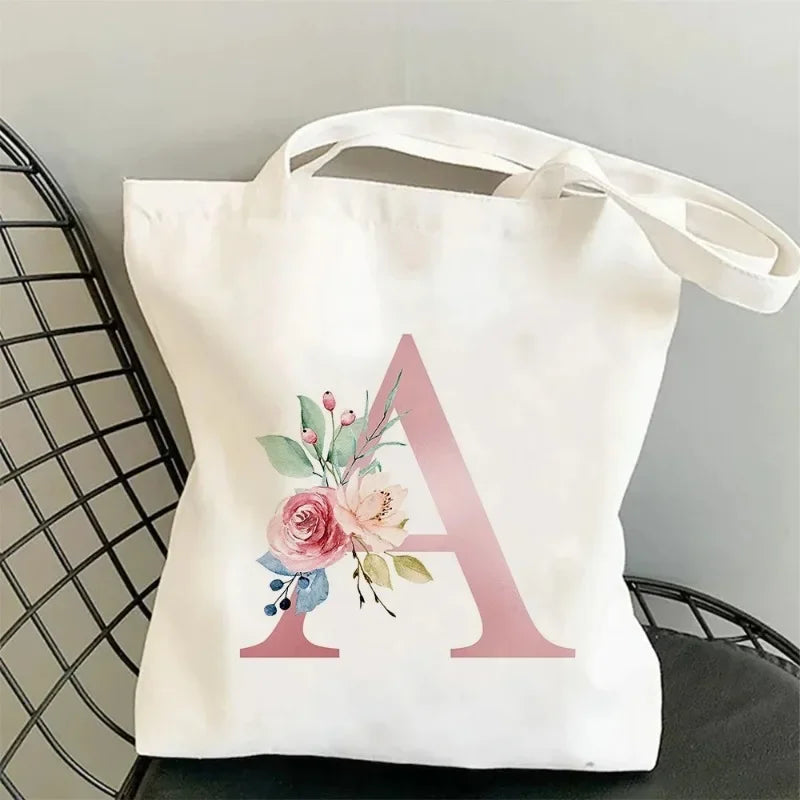 sac main blanc lettre stylisée moderne poignées détachables grandes capacités élégant toile personnalisable voyage