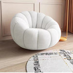 fauteuil moderne velours bouclé doux repos pieds beige clair intérieur meubles salon contemporain