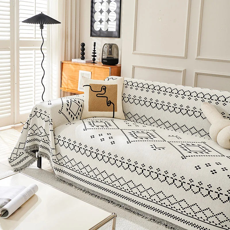 couverture canapé moderne beige noir motif géométrique franges oreiller décoratif ethnique