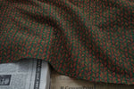 tissu polyester jacquard motif feuilles vert foncé rouge rustique épais texturé plié bricolage automne