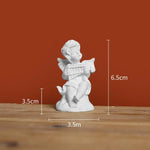 décoration intérieure colonne classique sculptée or noir blanche ange statuaire