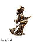 statuette féminine sorcière robe longue baguette magique balai art deco bronze doré intérieur