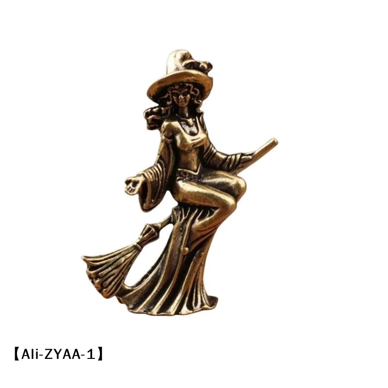 statuette féminine sorcière robe longue baguette magique balai art deco bronze doré intérieur