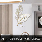 horloge murale moderne blanc doré plume stylisée sans LED fixation sans éléments visible