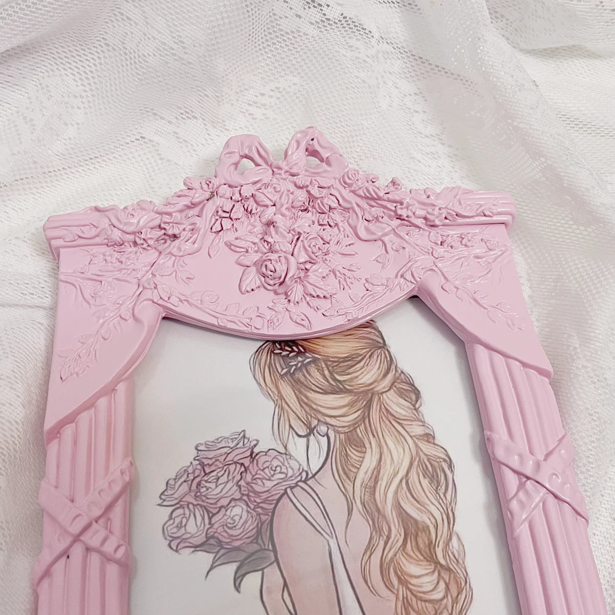 Détail du nœud rose du cadre photo