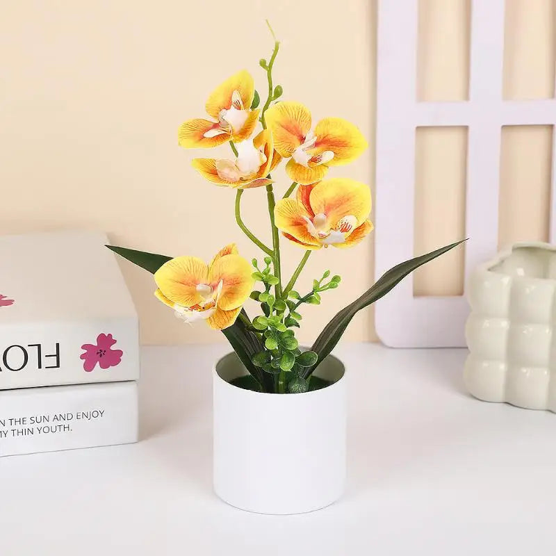 décoration intérieure orchidées artificielles pots blancs fleurs simples feuilles vertes moderne
