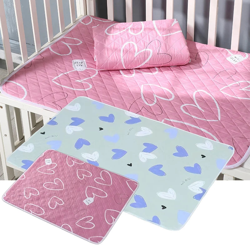 matelas bébé adulte imperméable lavable rose vert menthe cœurs dinosaures texture quiltée moderne 50x70cm