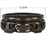 support bois ornements sculptés complexe artisanal marron foncé traditionnel décoration maison objet décoratif stand