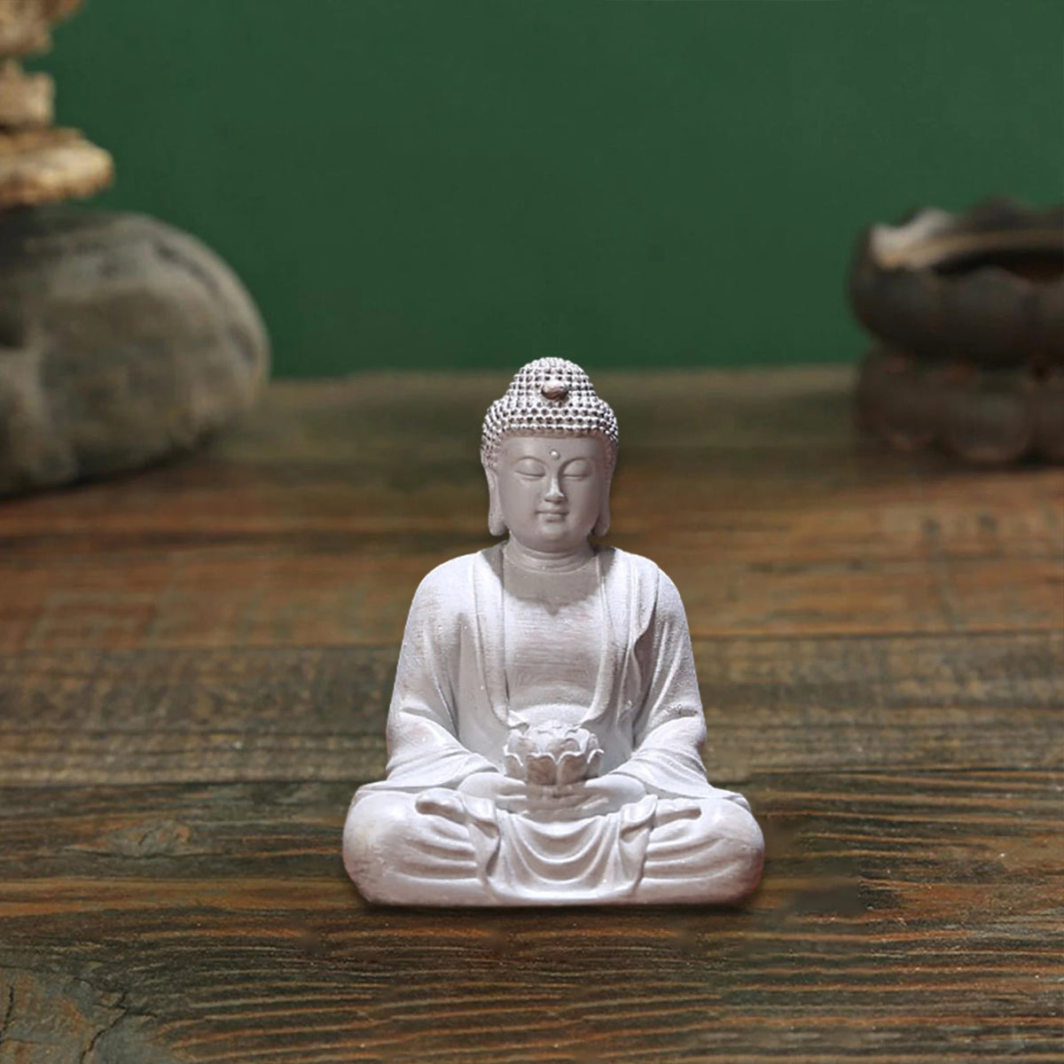statue bouddha zen blanc gris bois décoratif assiette cigarettes tapis fibres naturellements éléments divers