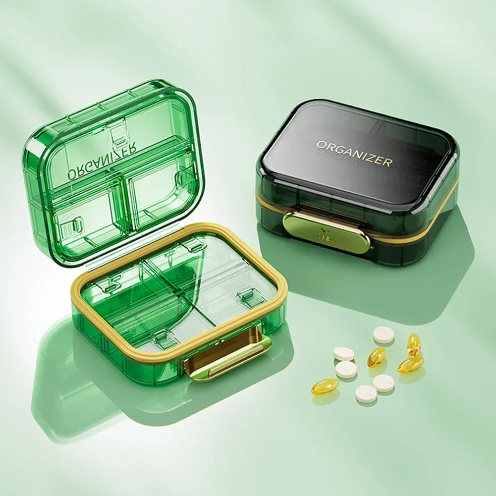 boîte rangement médicaments réutilisable transparente moderne vert bleu violet poignée dorée compartments
