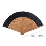 éventail traditionnel rose clair vert noir rayures géométriques opacité pliant bambou tissu pompon rouge