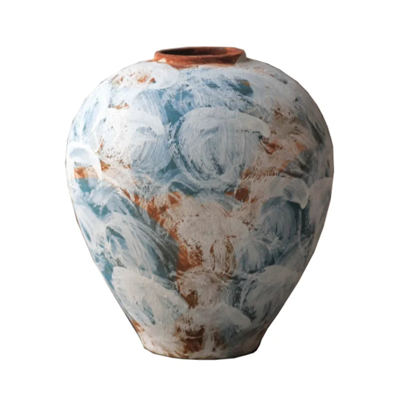 vase artisanal bleu blanc marron marbré rustique arrangement floral branches fruits decoration intérieure