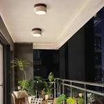 lampe moderne minimaliste bois pierre texture naturelle beige brun foncé éclairage led murale
