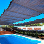 Voile d'ombrage vague HDPE blanc installée sur balcon