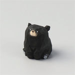 statue animale bois figurine bleu rose motif floral minimaliste yeux stylisés petite deco