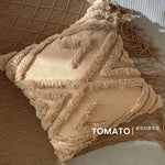 taies d'oreiller géométriques brodées boho chic couleurs beige orange gris franges respectueuses environnement decoration