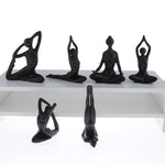 ornements deco moderne figurines yoga noires differentes poses minimaliste sculptural
