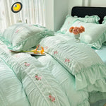 ensemble literie romantique broderies roses volants drap plat oreillers taies d'oreiller couleurs pastel vert
