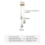 suspension lumineuse moderne or blanc sphères translucides pièces structure métal doré