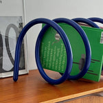supports livres spirales moderne minimaliste rouge bleu rose jaune gris sans motif.surface lisse