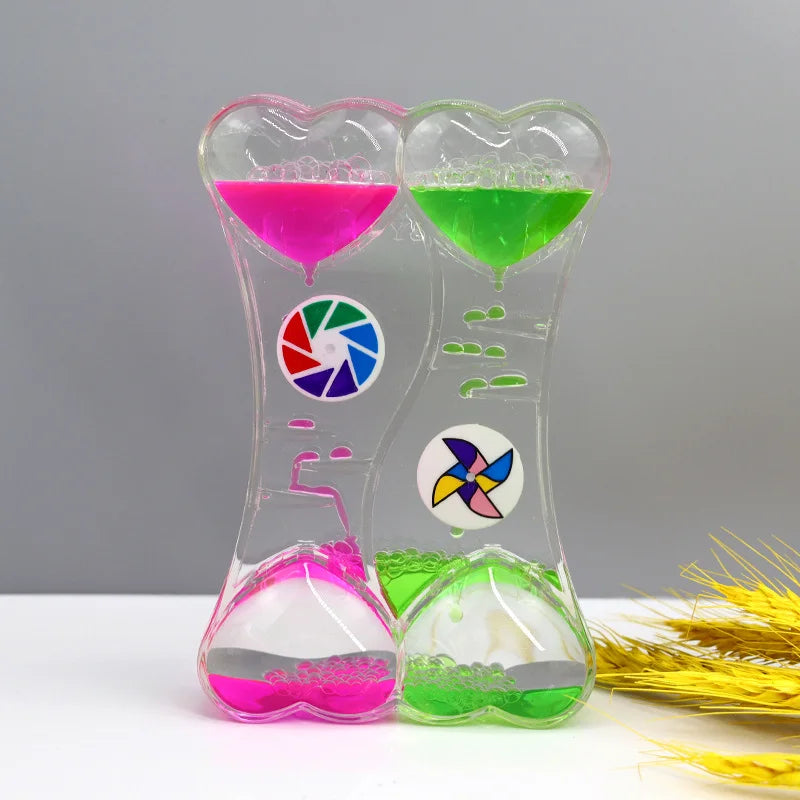 minuteur sablier liquide bicolore transparent motifs géométriques souriant deco moderne