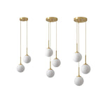 suspension lumineuse moderne or blanc sphères translucides pièces structure métal doré