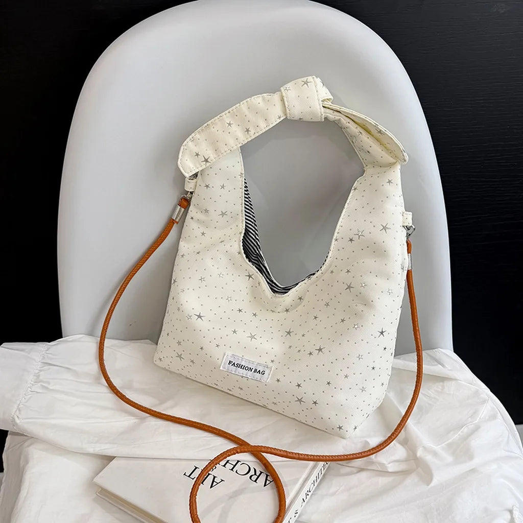 sac main femme rose clair étoiles dorées doux moderne casual tote toile