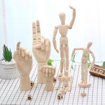 mannequins articulés bois classiques tailles diverses naturel clair base circulaire minimalistes adultes